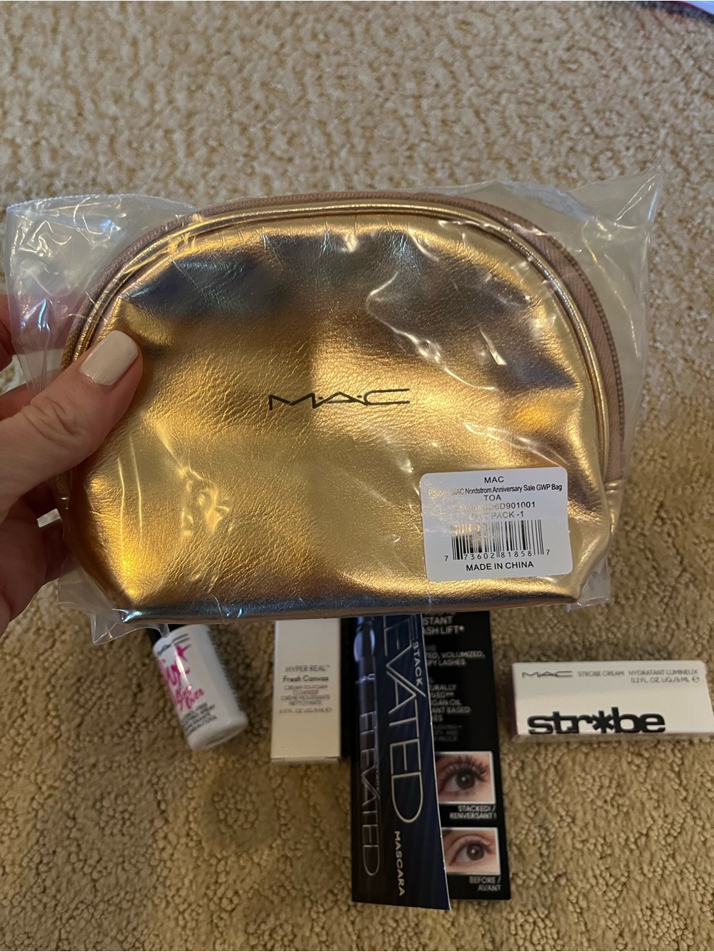 MAC gold pouch with makeup gift set